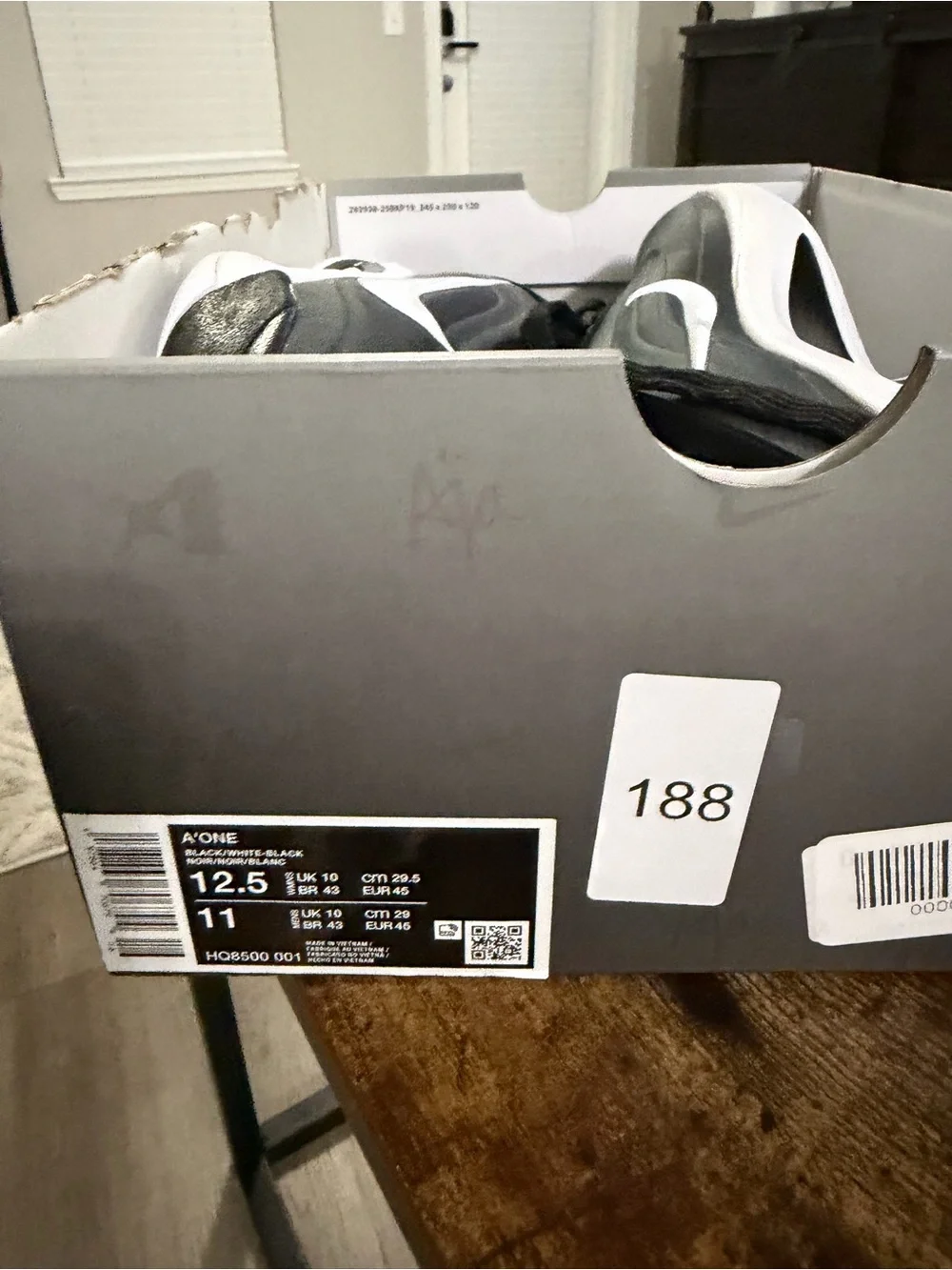 Nike Men's Black and White Running Shoes with Swoosh Accent